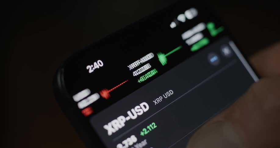 A person is scrolling stocks on his cell phone