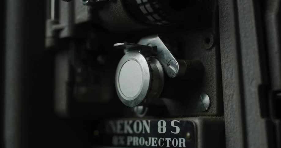 A projector has a name plate on the side