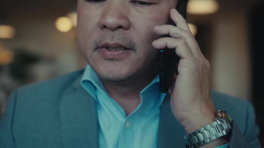 Portrait of a man in a suit sitting working