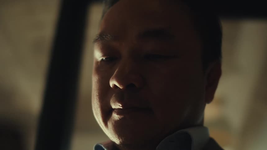 The face of a man with a serious expression