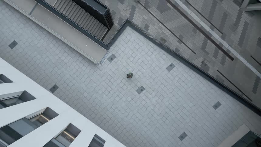 Aerial view of the courtyard of a building with geometric patterned windows