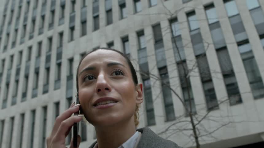 Woman outdoors talking on a phone call