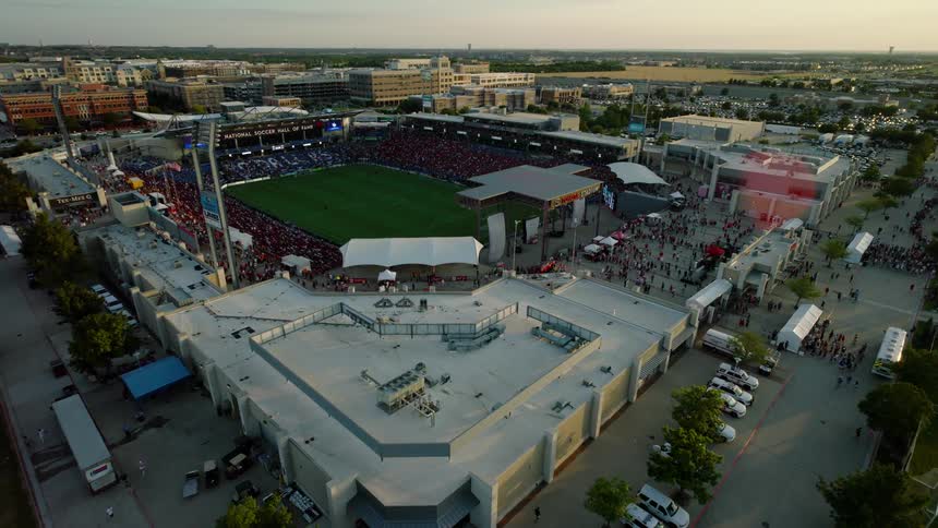 An aerial clip of a stadium in a city