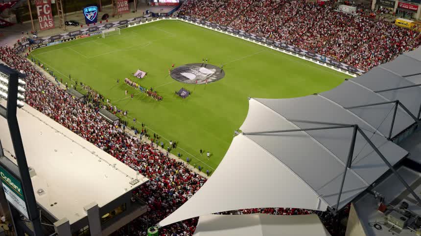 Soccer players are lined up on the field