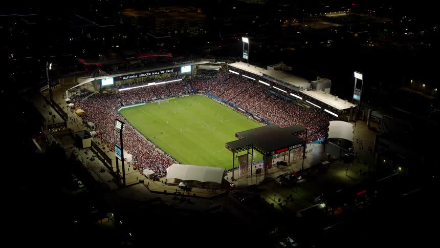 Aerial view of a stadium with a crowd of people at night