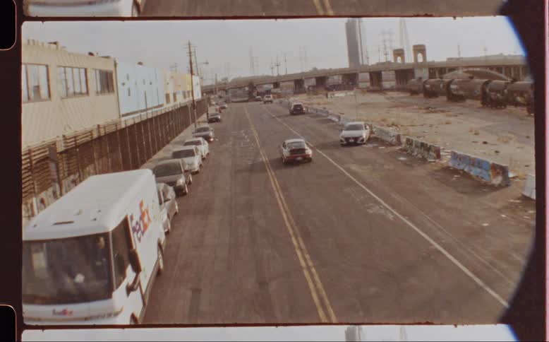 Aerial view of a classic sports car driving on a highway
