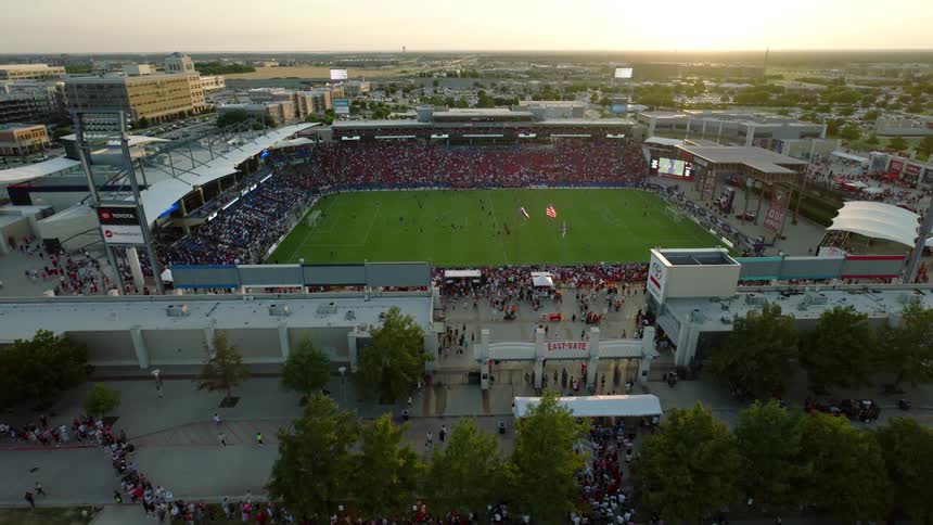 Aerial view of a sports stadium with a crowd of fans