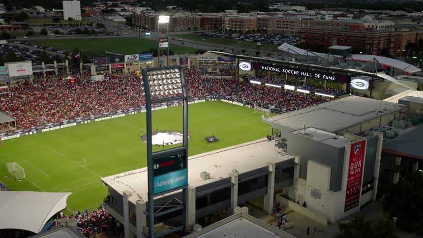Aerial view of a crowd of people in a stadium at night
