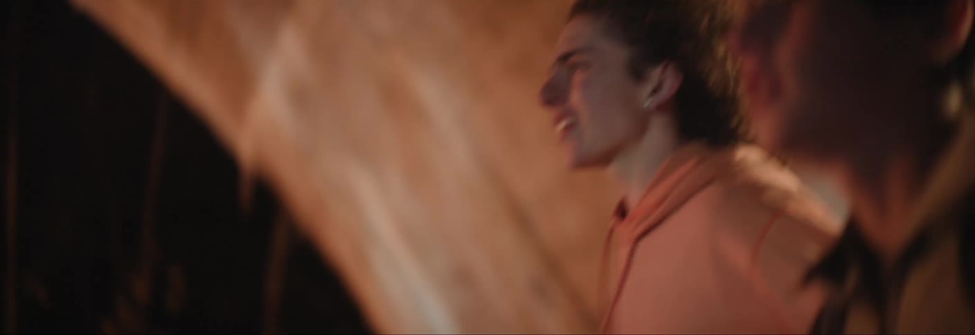 Two teenagers run at night time
