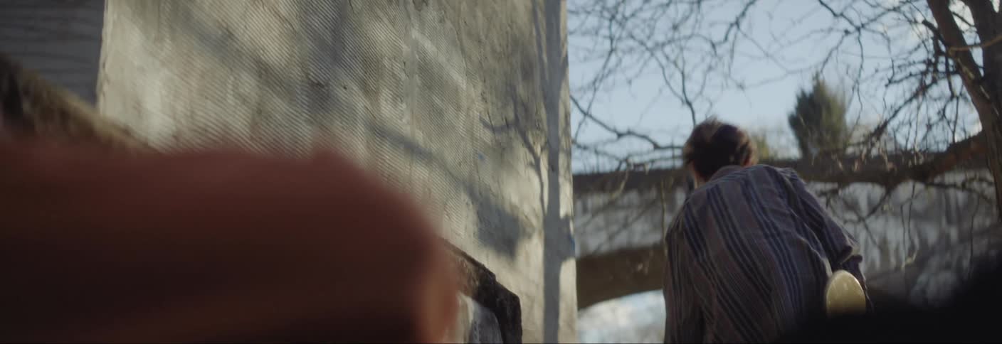 A clip of boys holding a skateboard