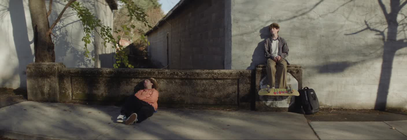 Teenagers hang out and talk before walking away