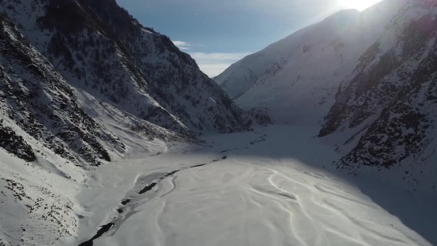 The mountain range is covered with snow