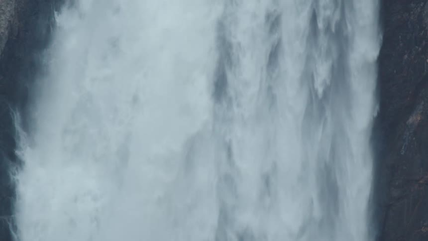 Waterfalls flowing down a mountain cliff