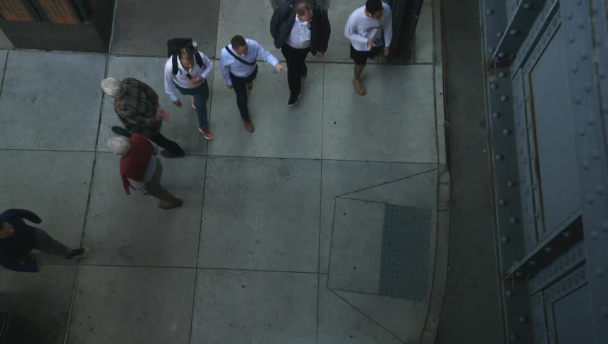 Pedestrians walking on a city sidewalk