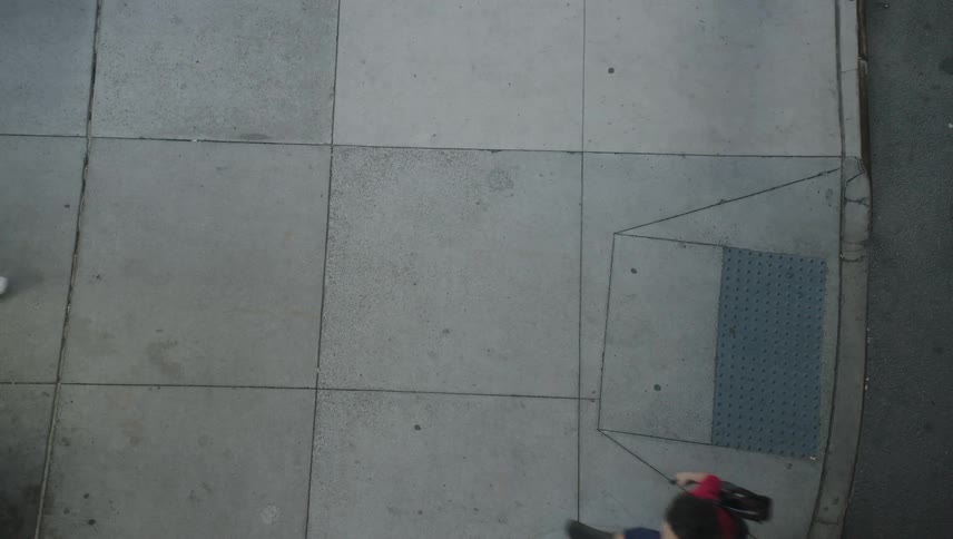Pedestrians walking on a sidewalk