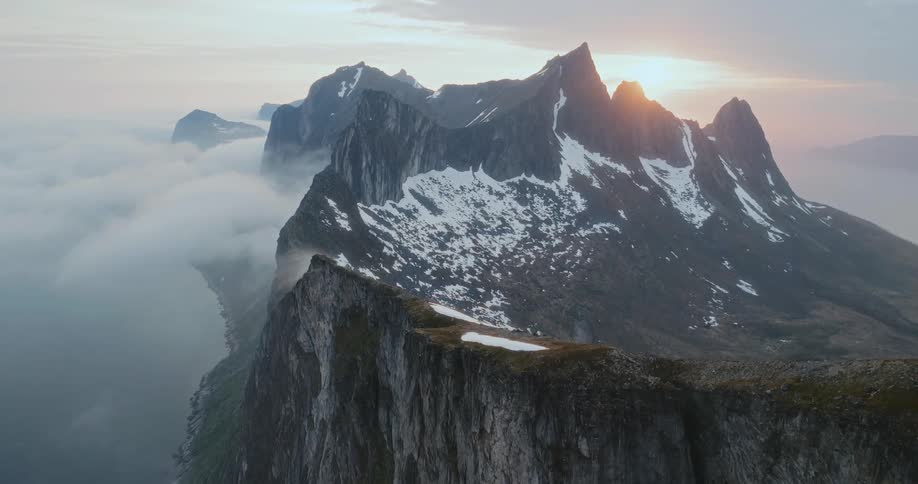 The mountain rises above the clouds