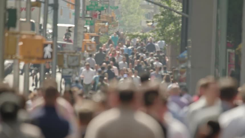 Crowd of people walking on the streets of a metropolis