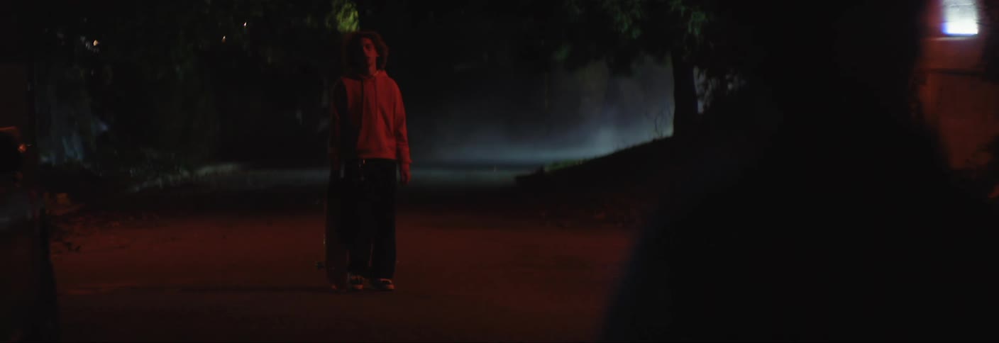 Boy run to his brother for a hug after his brother has kissed his girlfriend at night