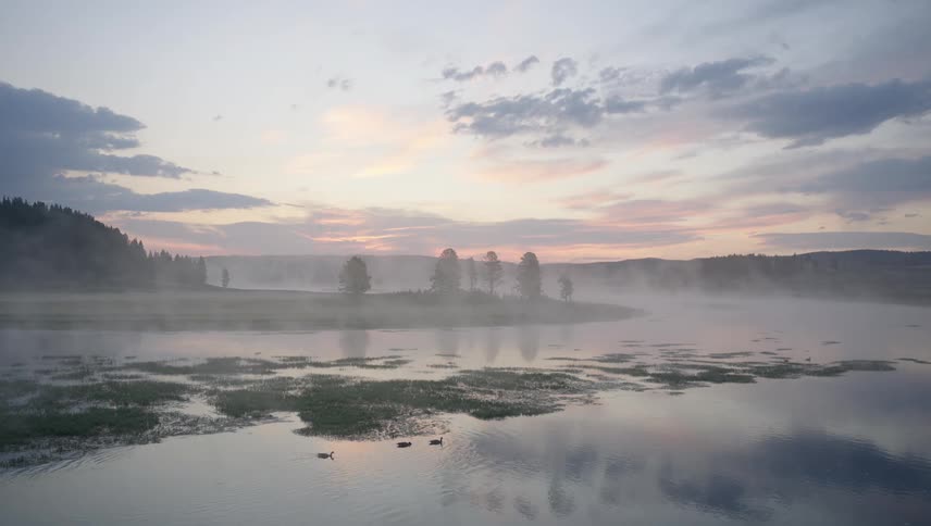 Clouds are reflected in the still waters of the moor