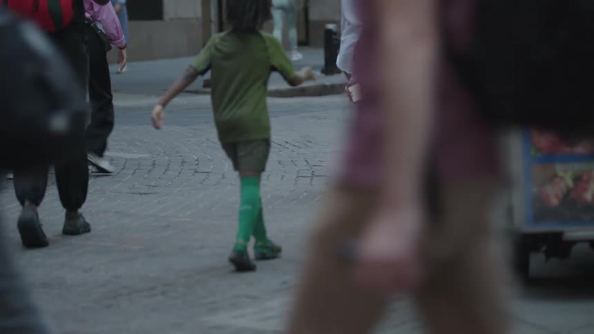 Pedestrians walking through the streets of a city