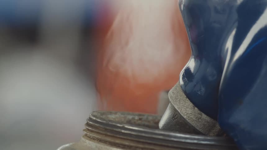 Fumes rise from the gas pump