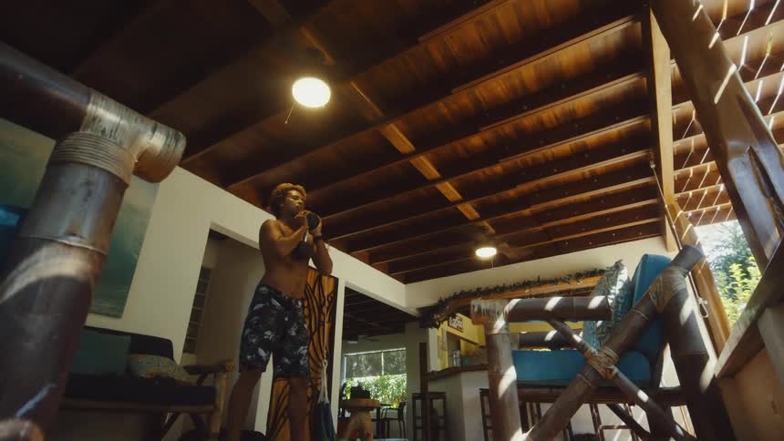 Shirtless man doing free weight squats