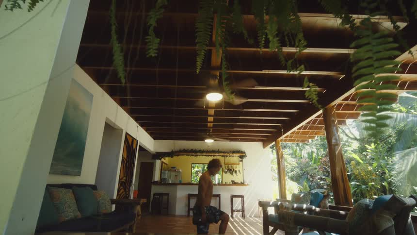 A man is lifting weights on the porch