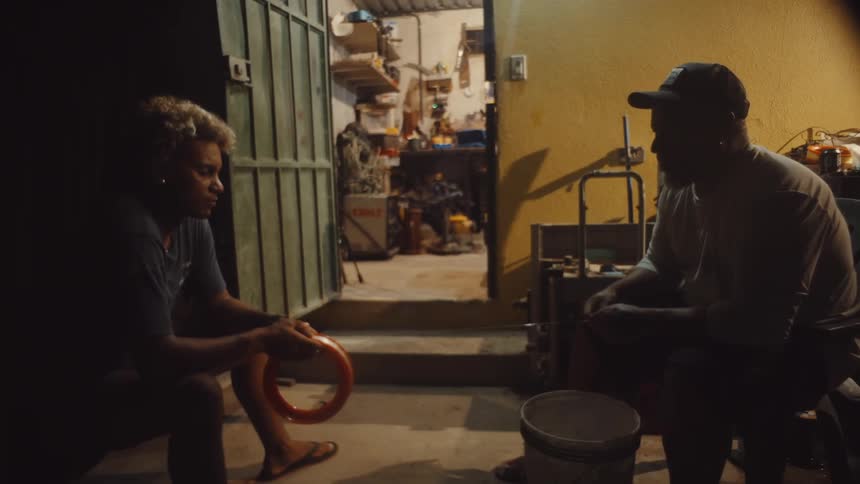 A clip of two men holding a rope