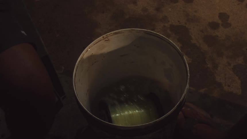 A spool of fishing line is spinning in the bucket