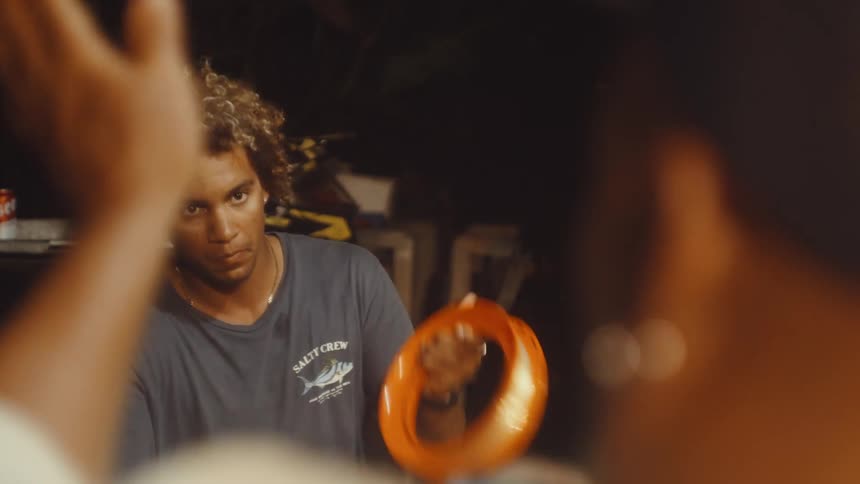 A man is wrapping fishing line on a reel