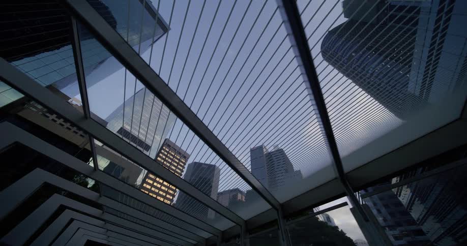 A walkway connects the buildings in the city