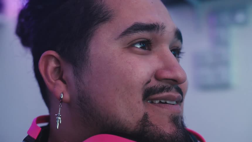 A clip of a males face smiling