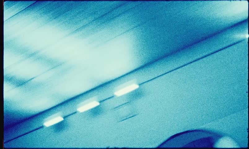 Outside the tunnel is a structure with traffic lights