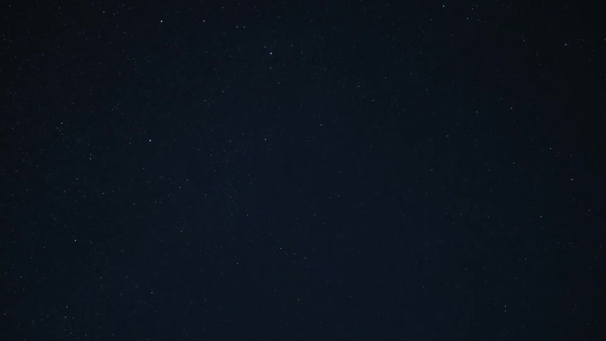 Landscape of a night sky passing a shooting star
