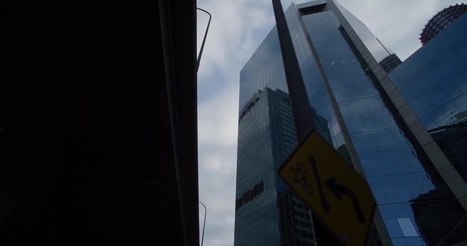 Buildings reflect off each other in the windows that are like mirrors