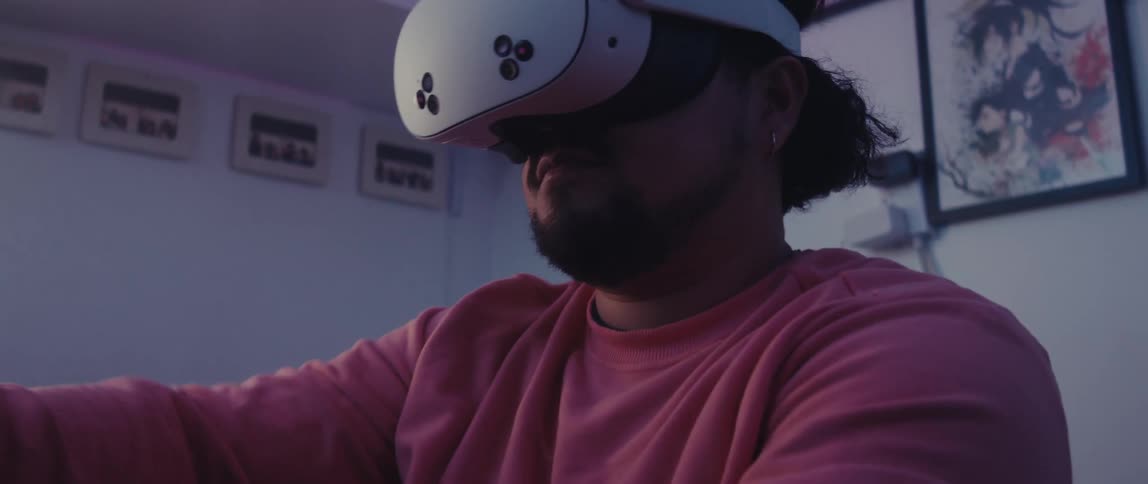 A person wearing a virtual reality headset is engaged in an immersive experience in a room decorated with anime posters and collectibles