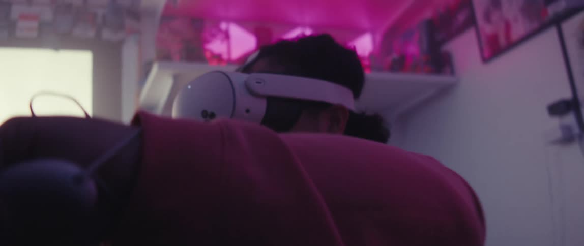 Man immersed in virtual reality using a headset and controller