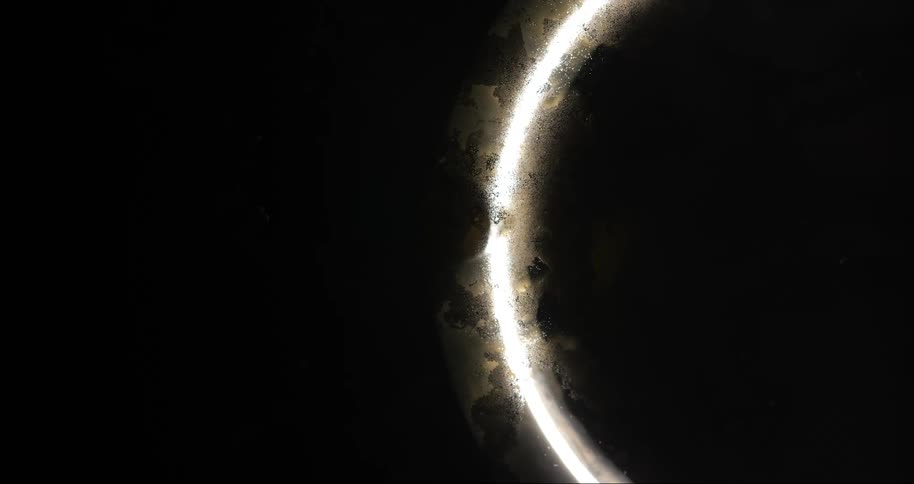 Bright ring of light contrasting with a black background