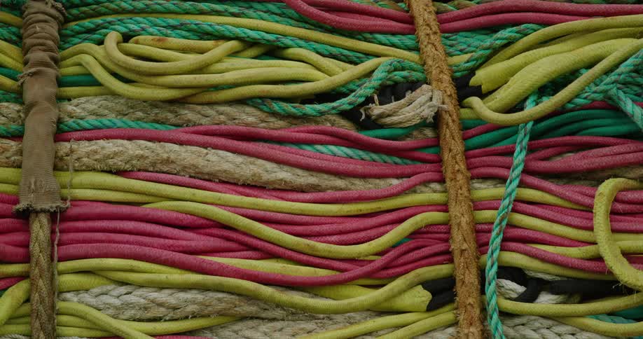 Several fishing nets, ropes and cables are bundled together