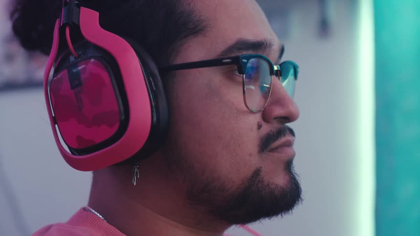 A man is listening to something on his headphones