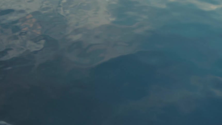 A body of water seen from a gliding kayak
