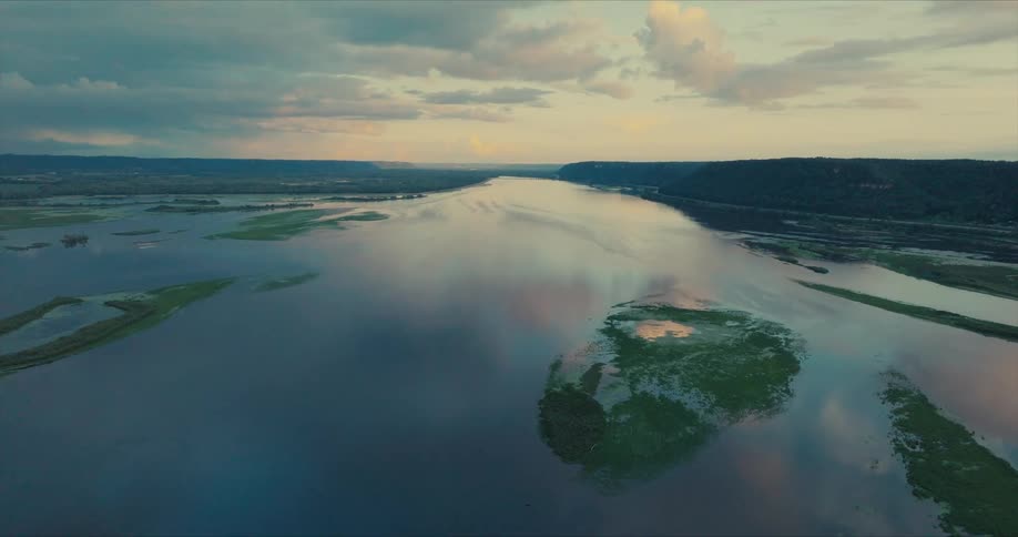 Aerial view of a lake reflecting the morning sky