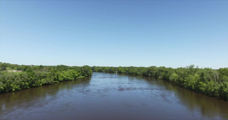 Aerial view of a river with banks surrounded by vegetation
