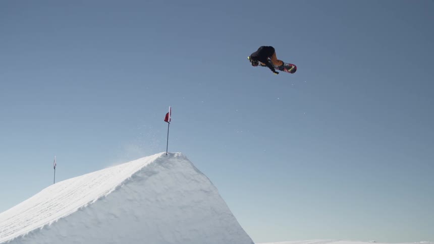 A person snowboarding on a sunny day