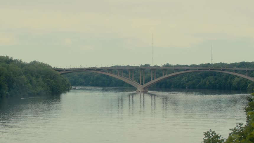 Bridge over a river in a place surrounded by vegetation