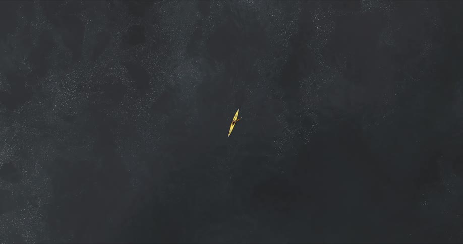 Aerial view of a person canoeing on a river