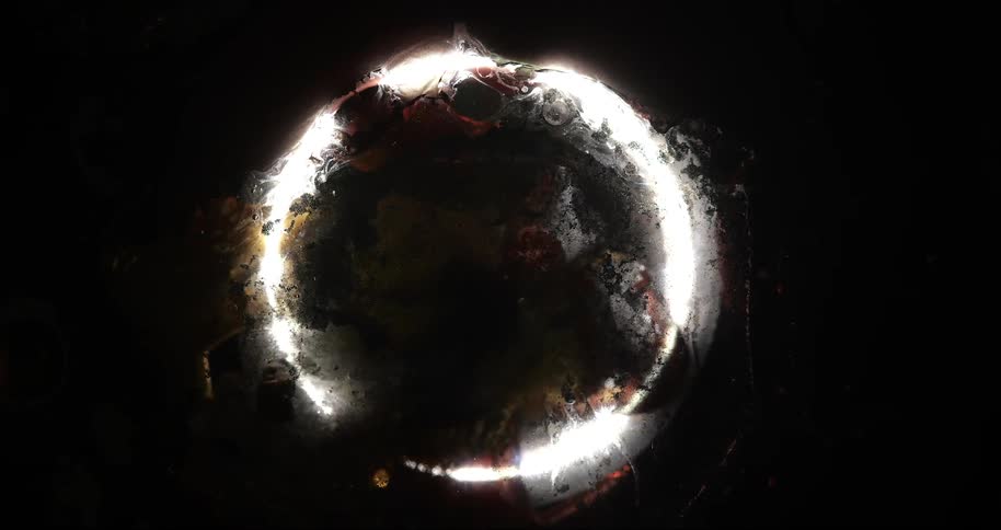 Abstract and mysterious vision of an illuminated circle with bright irregular edges
