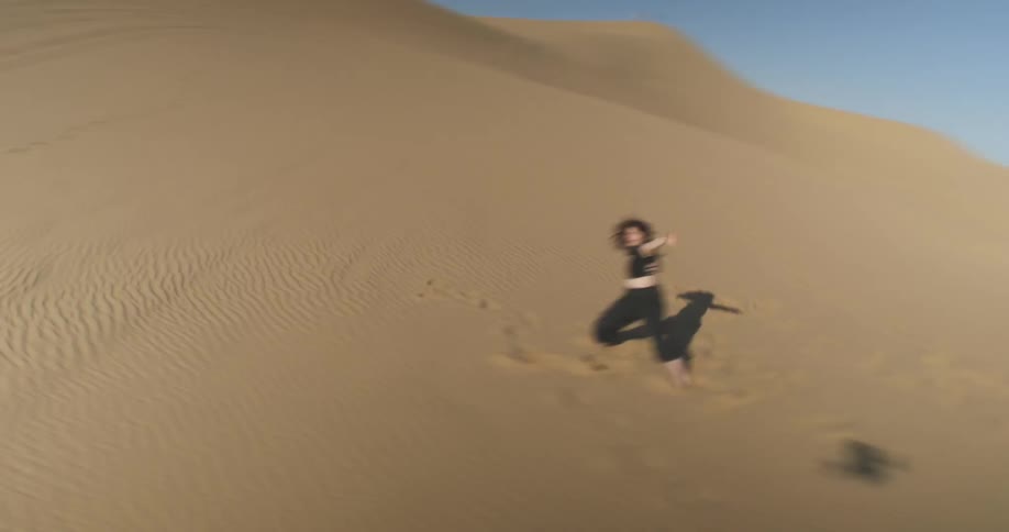 Woman dancing in the desert