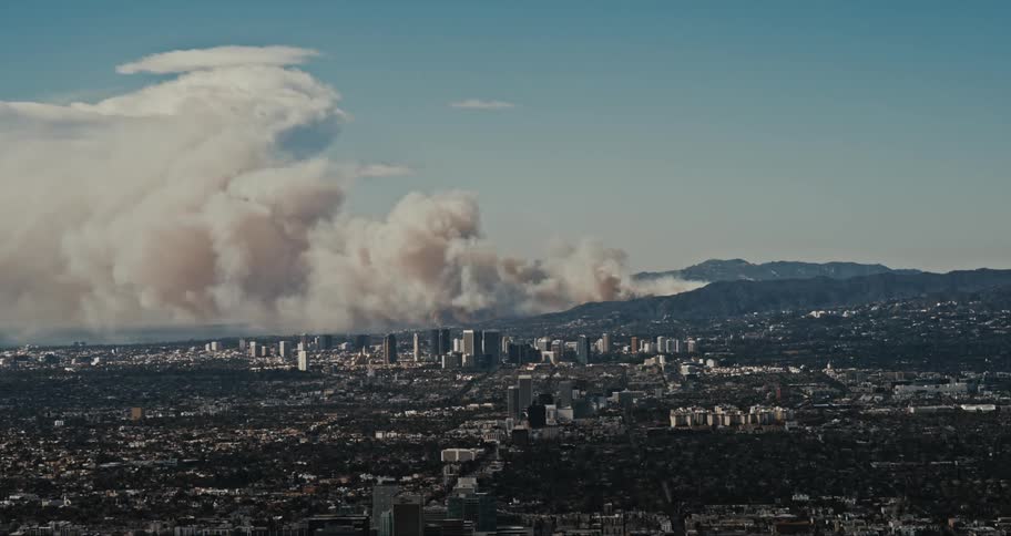 Large cloud of smoke rises from fires burning near West Los Angeles