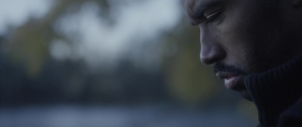 A man looks down towards the ground